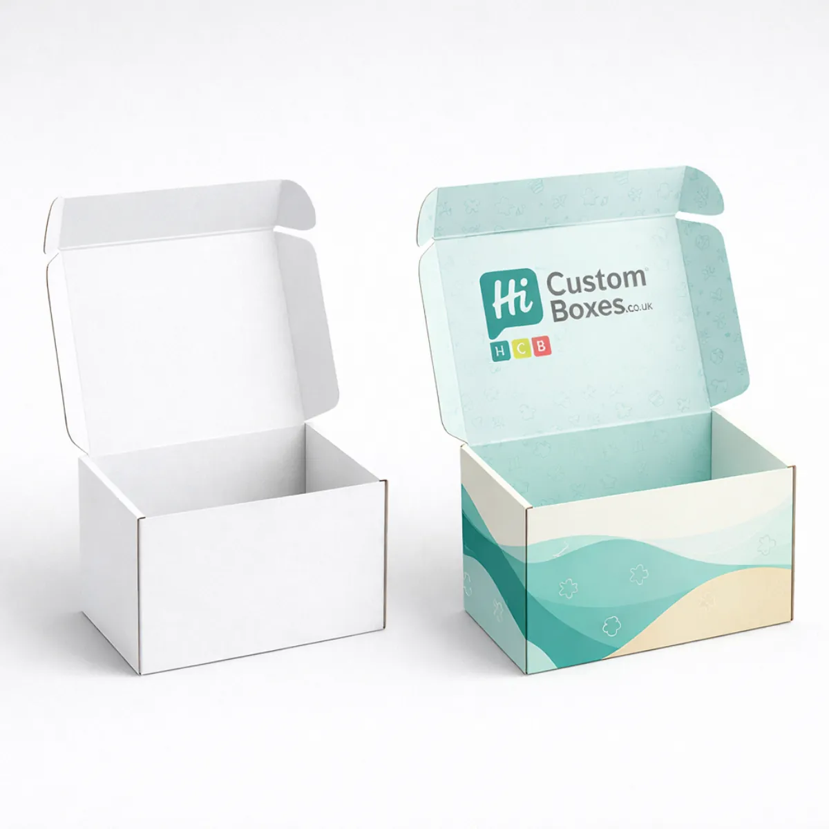 Two open white mailing boxes showing internal printed patterns and a logo on the lid- class=